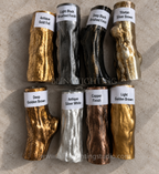 Branch series metallic finish sample swatches displayed as labeled branch-shaped pieces in gold, silver, copper, bronze, and black finishes.
