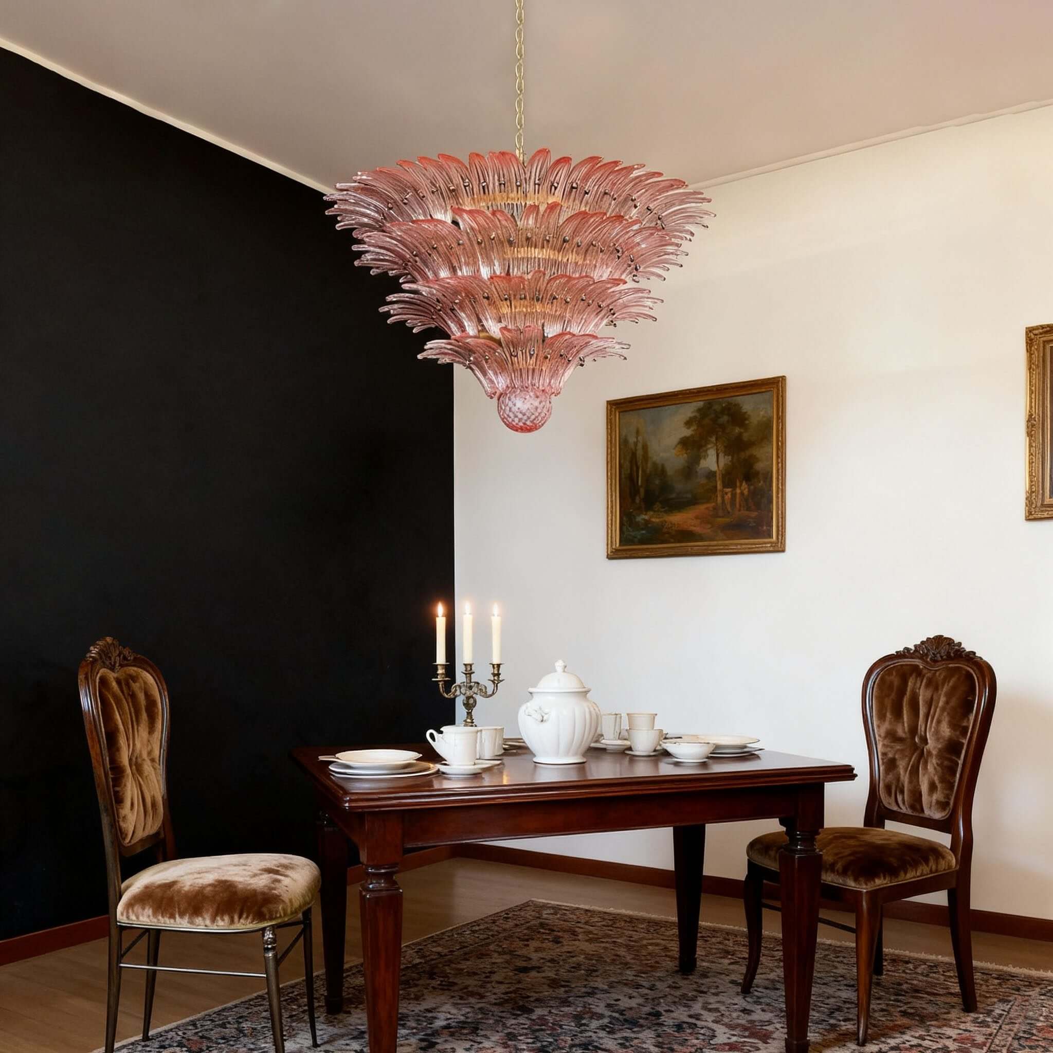 Pink glass chandelier hanging over a dark wood dining table.