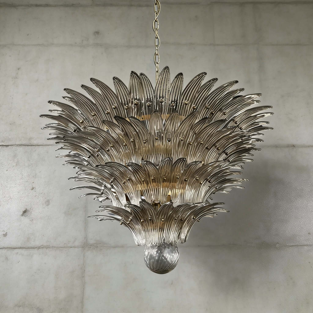Smoky gray glass Palmette chandelier shown in a large tiered studio view on a gray wall.