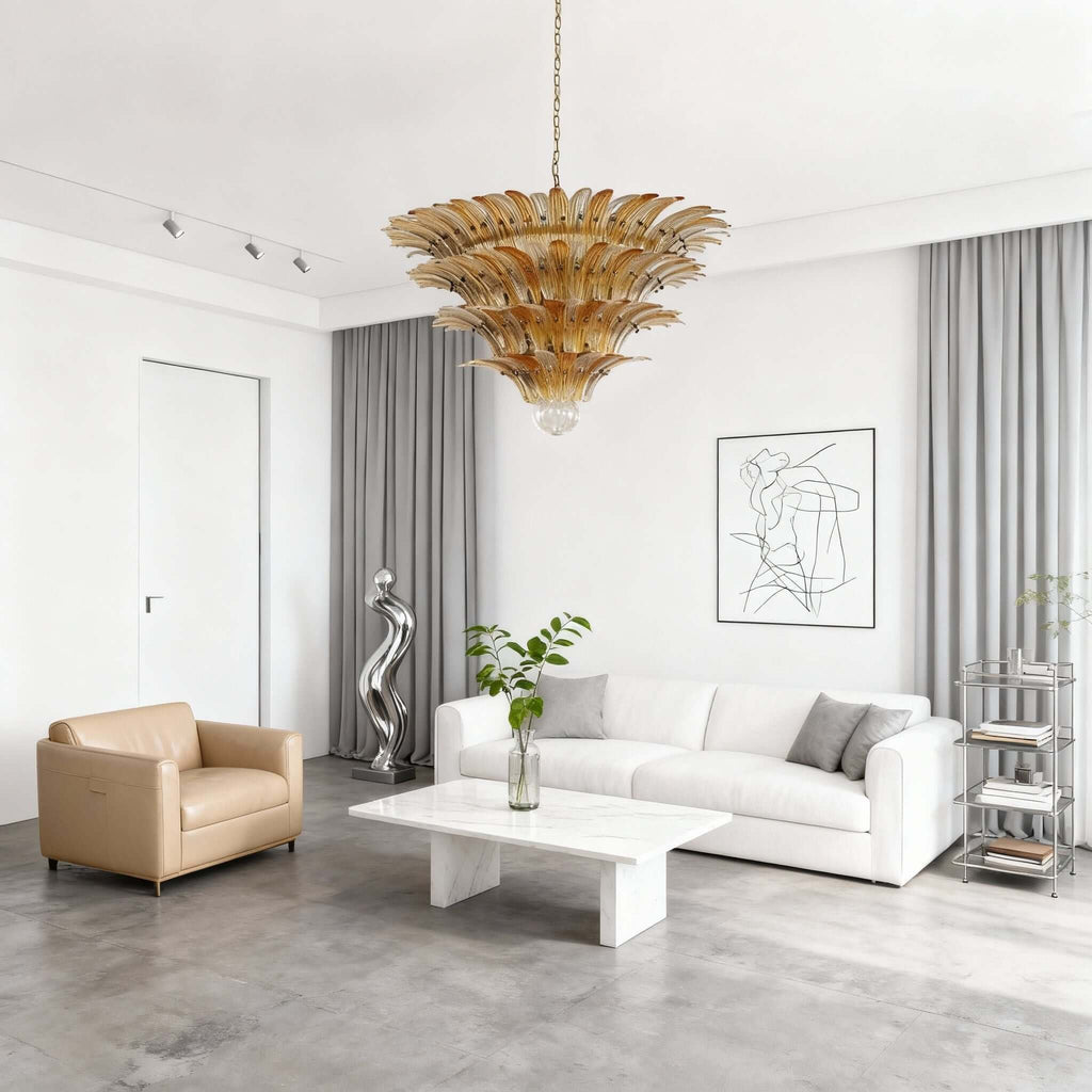 Amber glass chandelier above a white modern living room with low seating.